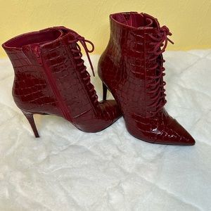 Red Aldo Heeled Boot. Lace up front , zip side. Size 7.